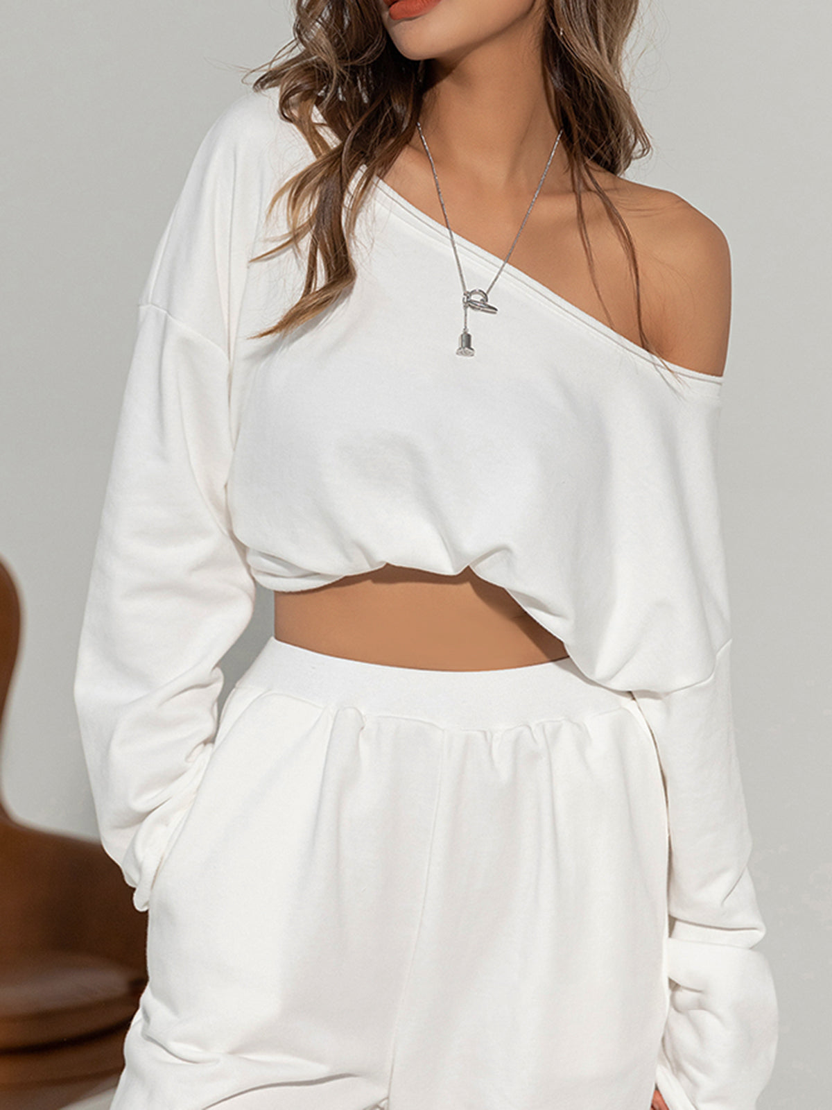 Asymmetrical Off-Shoulder Solid Color Sweatshirt